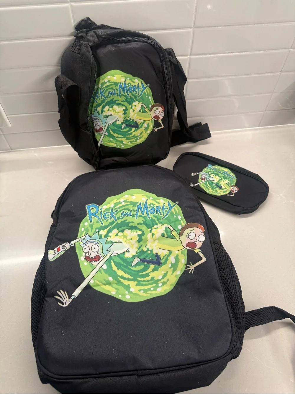 Rick and Morty 3 Piece School Set- Backpack Lunchbox, & Pencil Case.